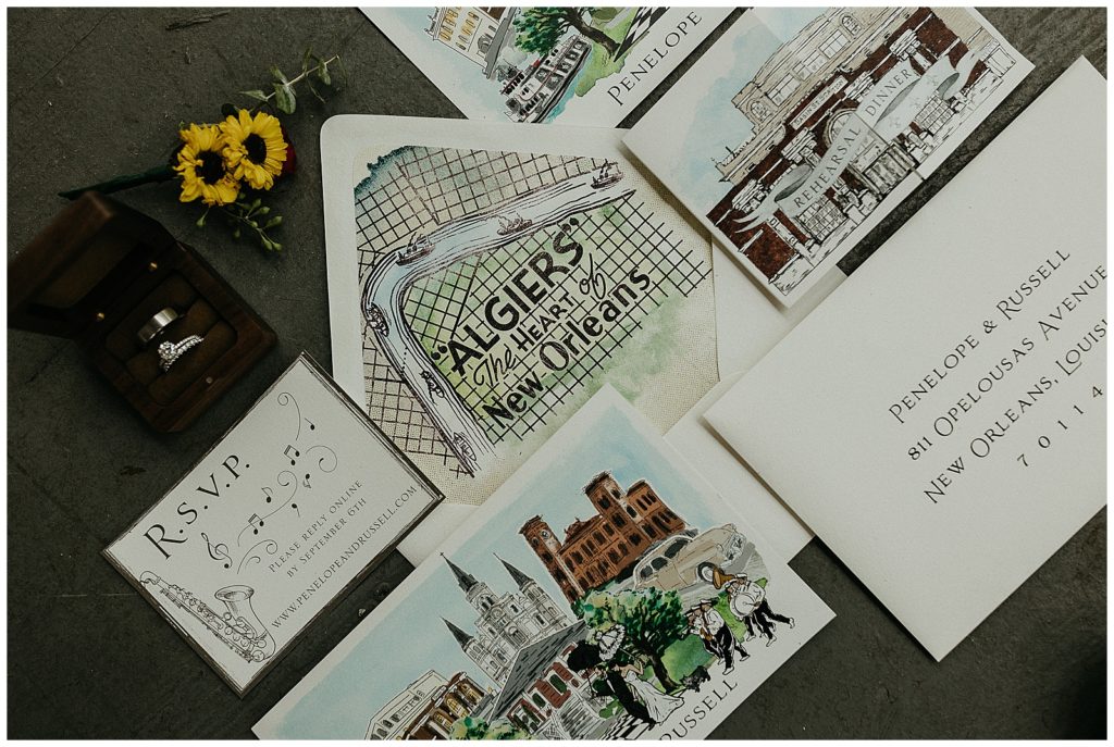 An invitation suite with details about Algiers Point at the compass point events wedding