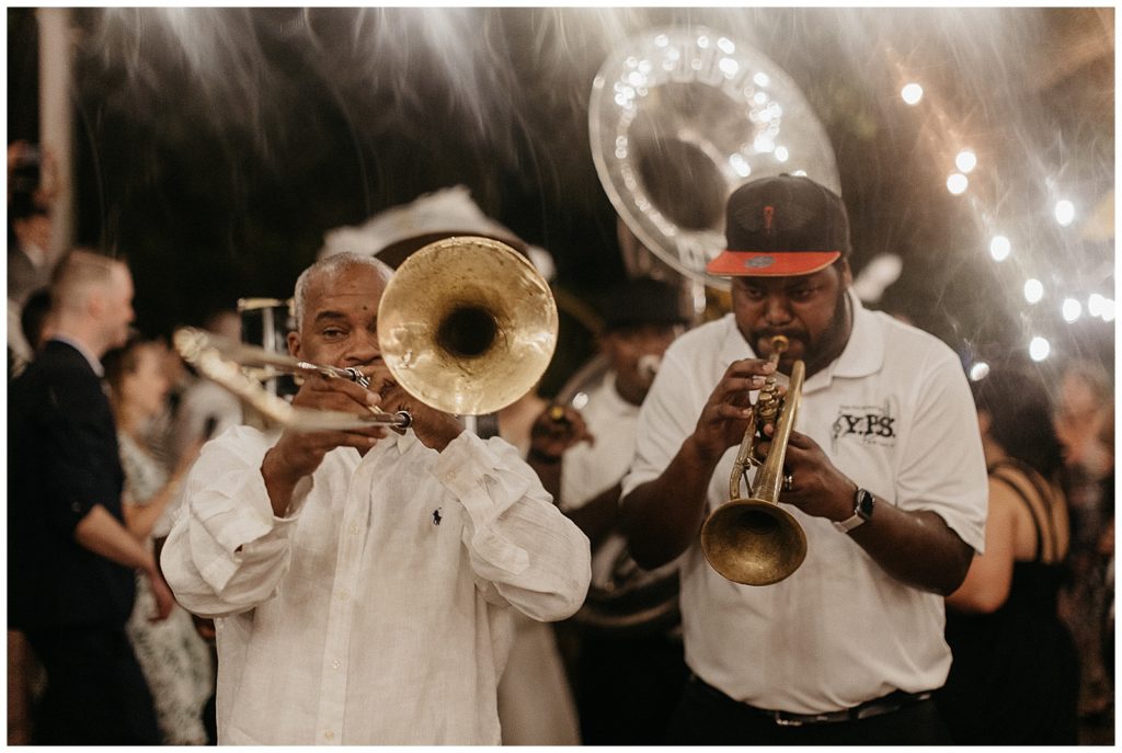 A brass band plays at the end of a compass point events wedding reception