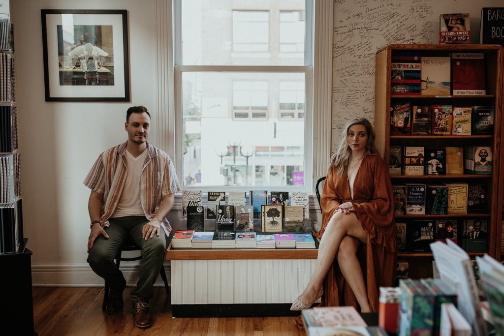 couple at bookstore engagement photos
