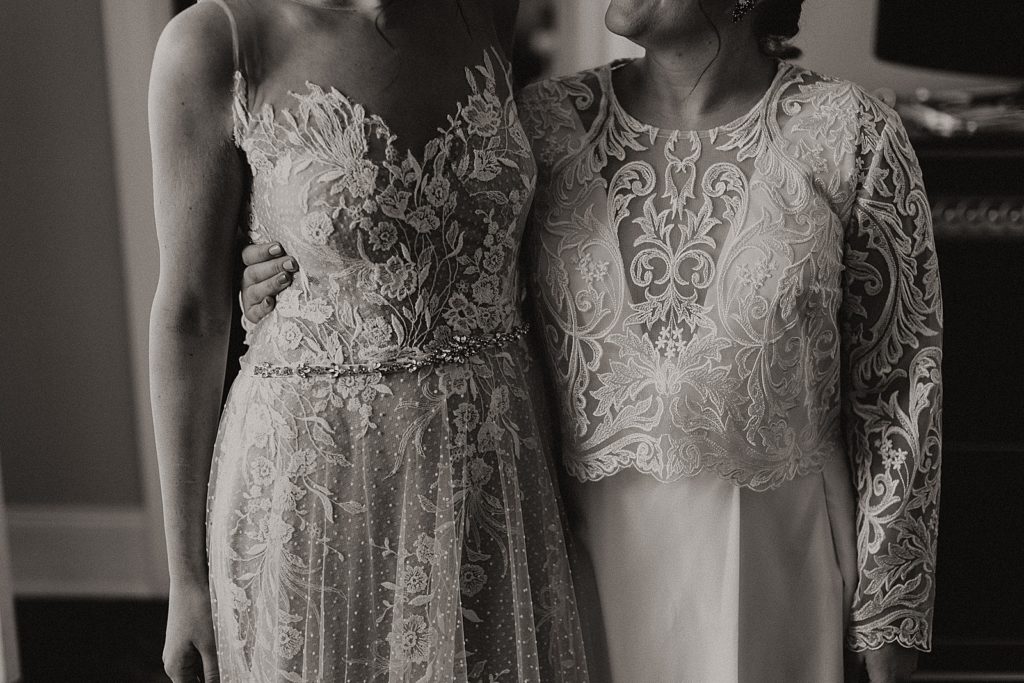 The brides wear dresses with lace details.