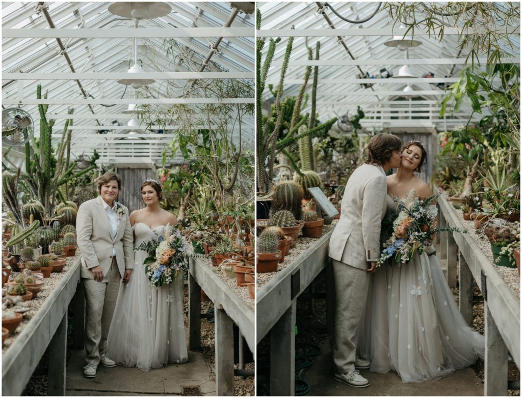 Britt and Em stand in the middle of the cactus house at their New Orleans Botanical Garden wedding.