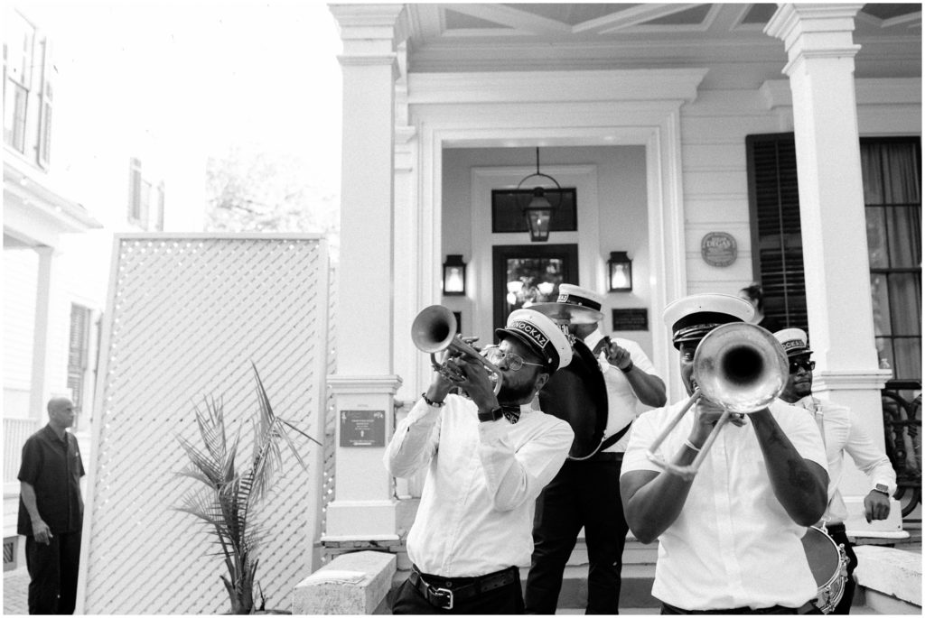 The Brass band plays on the Degas House porch.