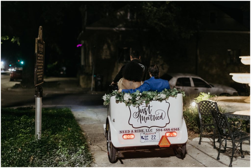 Alex and Isatu leave the wedding in a pedicab.