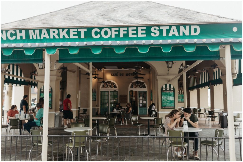 Diners sit in Cafe Du Monde, a New Orleans engagement photo location.