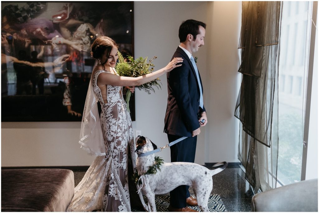 Marissa taps Michael's shoulder for their first look in a New Orleans hotel.