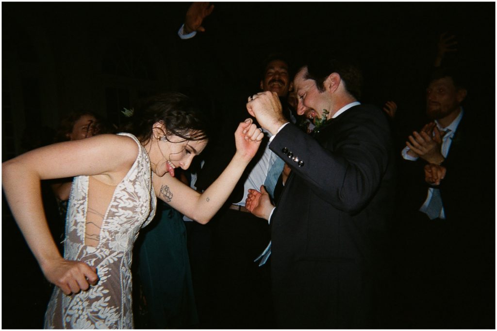 Marissa and Michael dance at their rainy wedding reception.