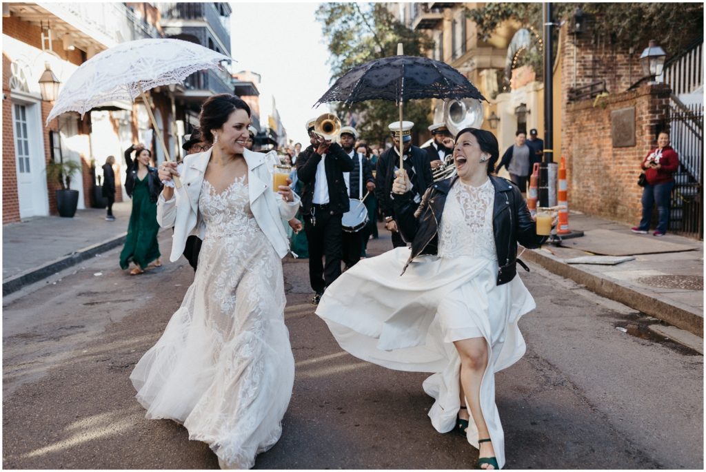 A bride twirls her skirt during a second line.