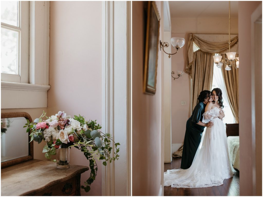 A bride and her mother embrace in a sunny pink hallway at Degas House.