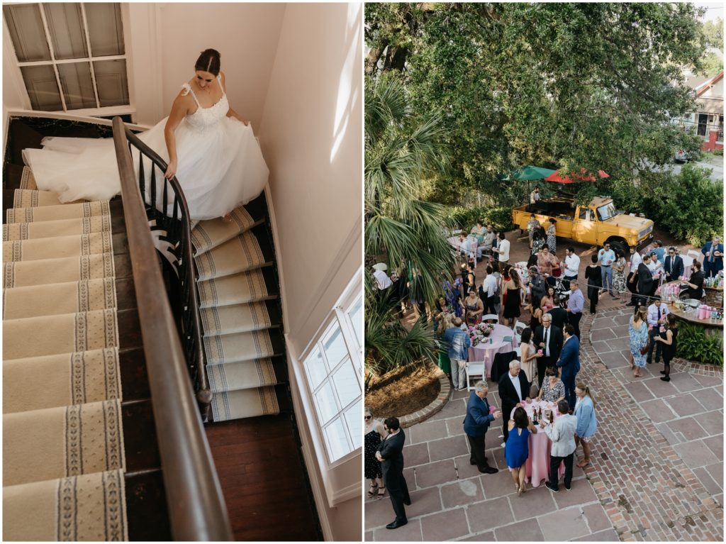 A bride walks down stairs towards a wedding reception in a courtyard.