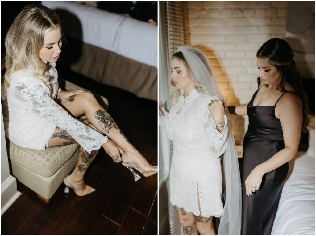 A woman helps a bride put on a long white veil.