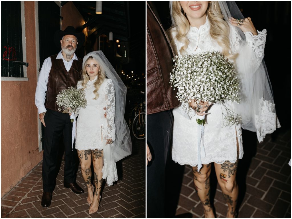 Nicole holds her wedding bouquet of baby's breath flowers and smiles.