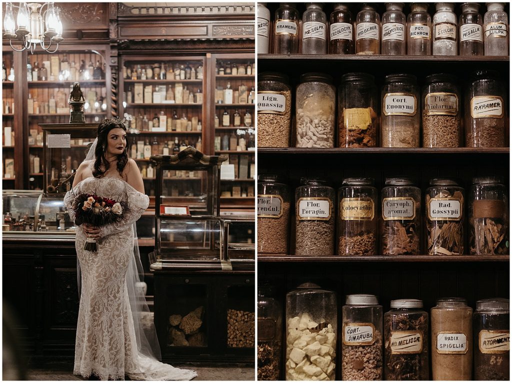 A bride poses in front of shelves of jars for a gothic wedding.