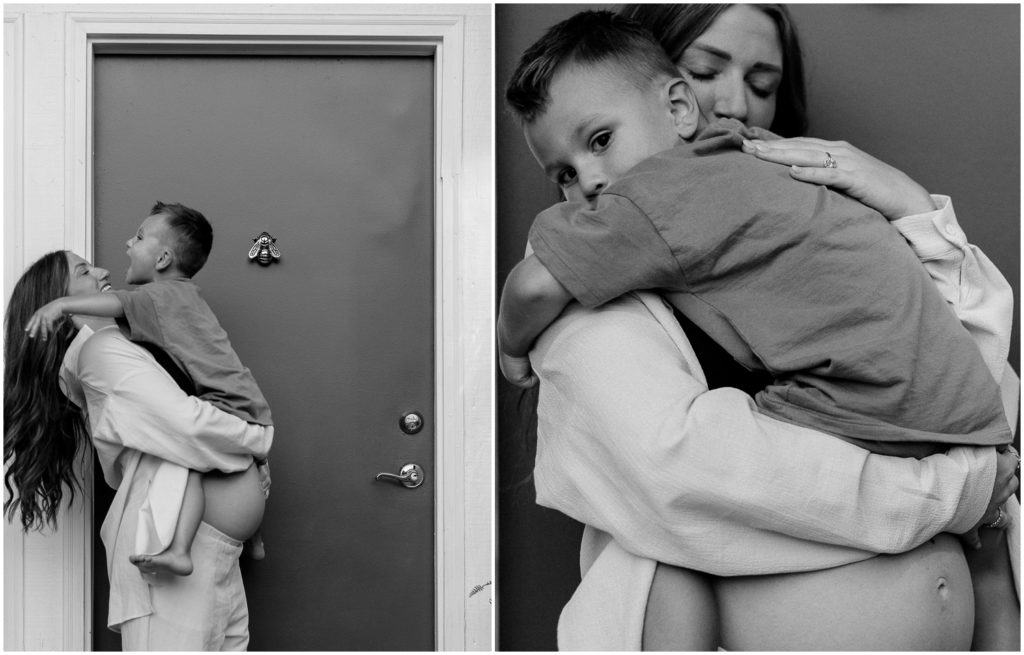 Cara holds Silas beside a doorway in maternity photos.
