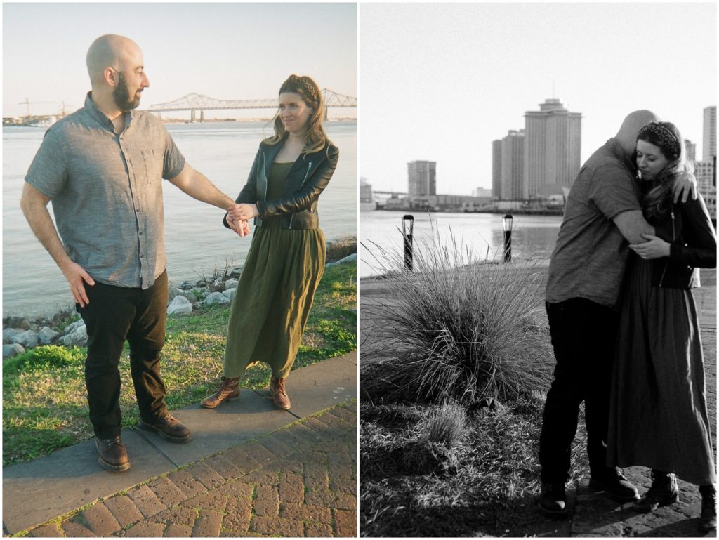 Omar and Anastasia stand on the levee overlooking the Mississippi River.